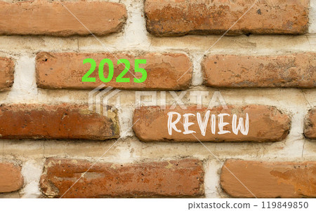 Planning 2025 review new year symbol. Concept words 2025 Review on beautiful brown brick wall. Beautiful brown brick wall background. Business 2025 review new year concept. Copy space. 119849850