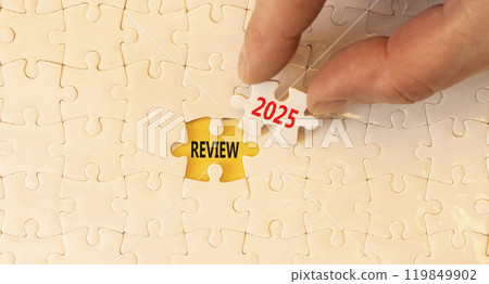 Planning review 2025 new year symbol. Concept words Review 2025 on beautiful white puzzle. Beautiful white puzzle background. Businessman hand. Business review 2025 new year concept. Copy space. Planning review 2025 new year symbol. Concept words Review 2025 on beautiful white puzzle. Beautiful white puzzle background. Businessman hand. Business review 2025 new year concept. Copy space. 119849902