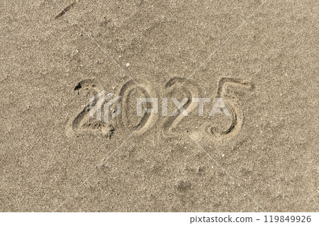 Business concept of 2025 new year symbol. Concept 2025 happy new year written on beautiful ocean sand beach. Beautiful ocean sand beach background, copy space. Business 2025 happy new year concept. 119849926