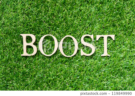 Wood alphabet letter in word boost on artificial green grass background 119849990
