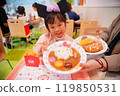 Girls eating curry 119850531