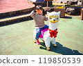 Girl riding an animal 119850539