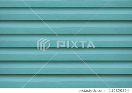 The green wooden vent lattice, serves as a vibrant background. 119850554