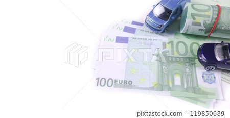Model car with euro banknotes on white background concept of saving for buying car, car loan and car insurance. Model car with euro banknotes on white background concept of saving for buying car, car loan and car insurance. 119850689