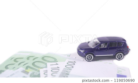 Model car with euro banknotes on white background concept of saving for buying car, car loan and car insurance. Model car with euro banknotes on white background concept of saving for buying car, car loan and car insurance. 119850690