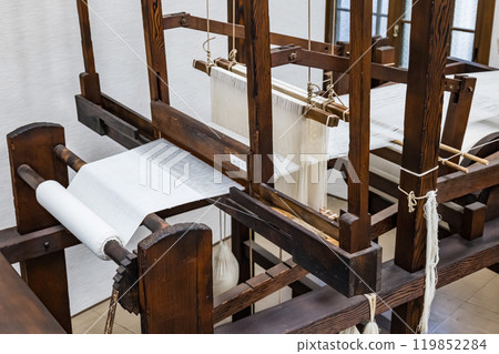 Old traditional hand-operated wooden loom, 119852284