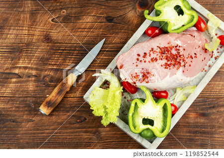 Raw cut of pork meat. 119852544