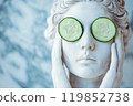 Statue of a Greek goddess with cucumber slices on eyes. Sculpture on spa treatments after bath. Beauty procedures, self-care, art, wellness, cosmetics and beauty salon, relaxation concept 119852738