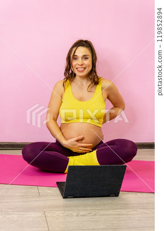 An expectant mother in a serene home setting, partaking in prenatal yoga An expectant mother in a serene home setting, partaking in prenatal yoga 119852894
