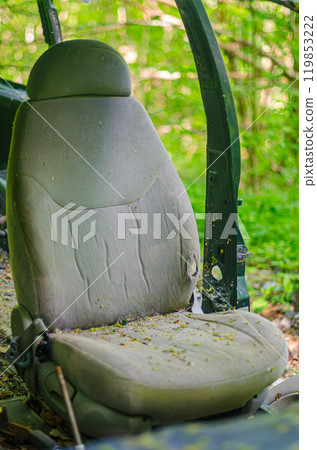 Old car seat in abandoned car in forest.. High quality photo 119853222