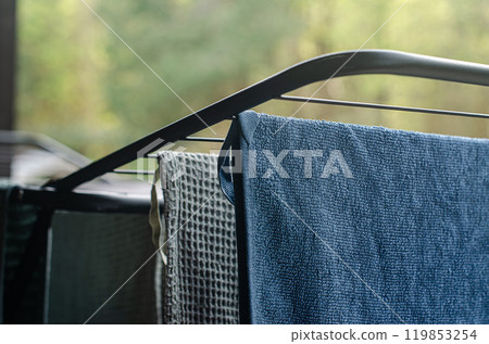 Blue and green towels hanging and drying after washing on the fresh air. High quality photo Blue and green towels hanging and drying after washing on the fresh air. High quality photo 119853254
