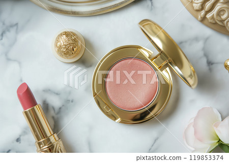 Decorative cosmetics in gold color packaging. Golden makeup products. Professional makeup products for fashion blogger. lipstick, blush and eyeshadow. 119853374