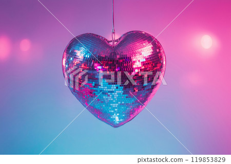 Heart shaped disco ball. Valentine's Day, love symbol and romantic exclusive relationships concept. Party decorations and dancing in nightclub theme. Heart-shaped discoball hanging from the ceiling 119853829