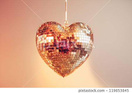 Heart shaped disco ball. Valentine's Day, love symbol and romantic exclusive relationships concept. Party decorations and dancing in nightclub theme. Heart-shaped discoball hanging from the ceiling Heart shaped disco ball. Valentine's Day, love symbol and romantic exclusive relationships concept. Party decorations and dancing in nightclub theme. Heart-shaped discoball hanging from the ceiling 119853845