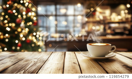 Cup of coffee with steam on empty wooden tabletop on blurred background of cafe decorated for Christmas 119854279