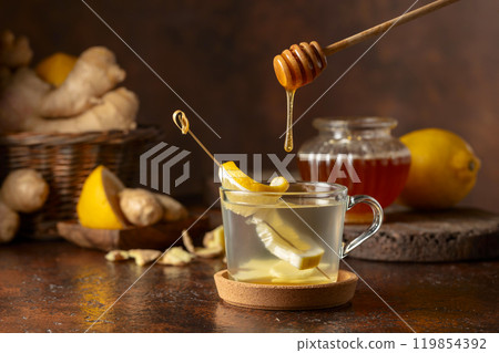 Ginger tea with lemon and honey. 119854392
