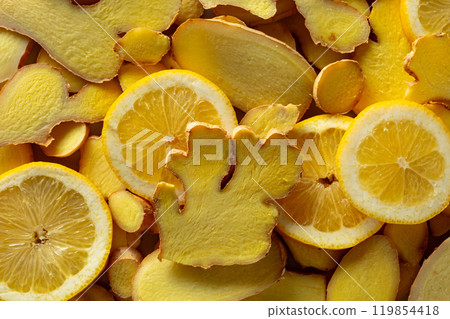 Close-up of fresh ginger and lemon slices. Close-up of fresh ginger and lemon slices. 119854418