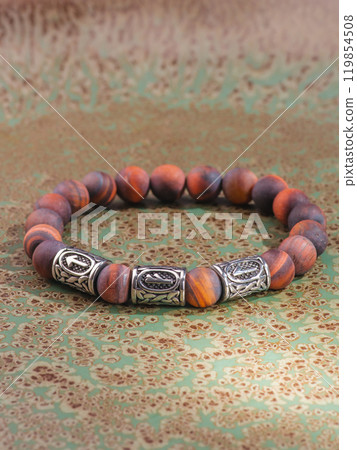Black Obsidian stone bracelet , Chinese men's modern retro style fashion. Isolated on white background Black Obsidian stone bracelet , Chinese men's modern retro style fashion. Isolated on white background 119854508