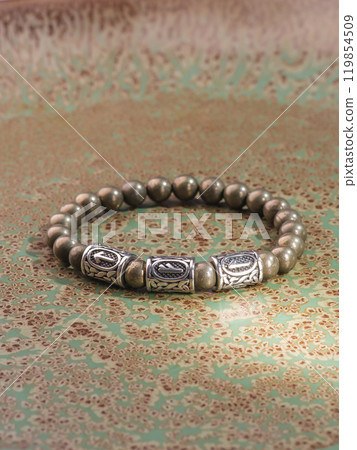 Black Obsidian stone bracelet , Chinese men's modern retro style fashion. Isolated on white background Black Obsidian stone bracelet , Chinese men's modern retro style fashion. Isolated on white background 119854509