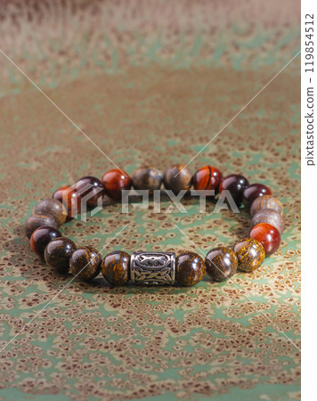 Black Obsidian stone bracelet , Chinese men's modern retro style fashion. Isolated on white background Black Obsidian stone bracelet , Chinese men's modern retro style fashion. Isolated on white background 119854512