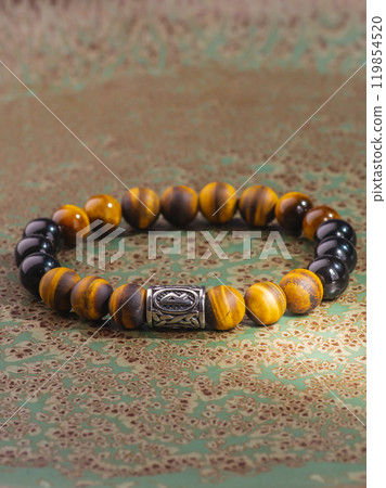 Black Obsidian stone bracelet , Chinese men's modern retro style fashion. Isolated on white background 119854520