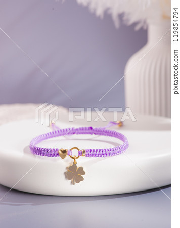 Woman's wrist wearing orange agate bracelet, isolated on white background. Woman's wrist wearing orange agate bracelet, isolated on white background. 119854794