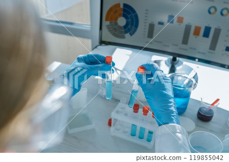 A skilled scientist in a lab conducts complex tests with specialized tubes and advanced methods, resulting in groundbreaking discoveries and significant advancements in research and technology A skilled scientist in a lab conducts complex tests with specialized tubes and advanced methods, resulting in groundbreaking discoveries and significant advancements in research and technology 119855042