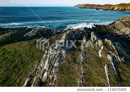 The rugged coastline features rocky formations The rugged coastline features rocky formations 119855085