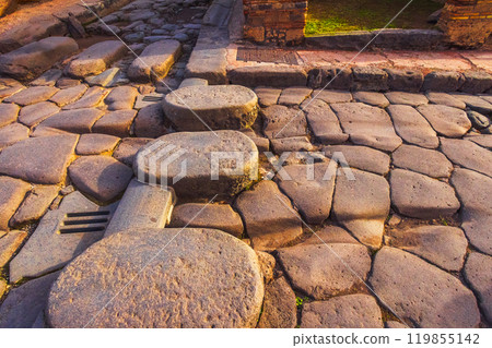 Ancient ruins of Pompei city, Naples, Italy. View of ancient street of Pompeii, Pompei is ancient Roman city destroyed from eruption of Mount Vesuvius in 1st century, Naples, Italy 119855142