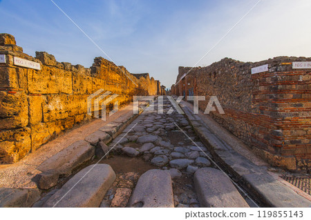 Ancient ruins of Pompei city, Naples, Italy. View of ancient street of Pompeii, Pompei is ancient Roman city destroyed from eruption of Mount Vesuvius in 1st century, Naples, Italy 119855143