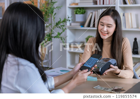QR code payment, customer using smartphone for paying at shop. Customer paying with qr code on smartphone screen payment technology at shop QR code payment, customer using smartphone for paying at shop. Customer paying with qr code on smartphone screen payment technology at shop 119855574