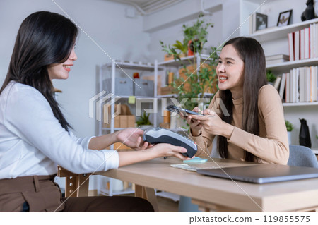 QR code payment, customer using smartphone for paying at shop. Customer paying with qr code on smartphone screen payment technology at shop QR code payment, customer using smartphone for paying at shop. Customer paying with qr code on smartphone screen payment technology at shop 119855575