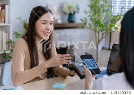 QR code payment, customer using smartphone for paying at shop. Customer paying with qr code on smartphone screen payment technology at shop QR code payment, customer using smartphone for paying at shop. Customer paying with qr code on smartphone screen payment technology at shop 119855579