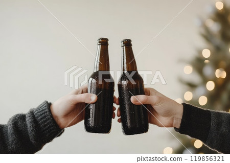 Cheers with Clinking Beer Bottles in Celebration 119856321