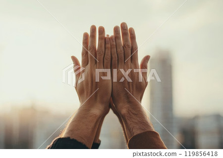 Teamwork Symbolized by Hands Stacking Together Teamwork Symbolized by Hands Stacking Together 119856418
