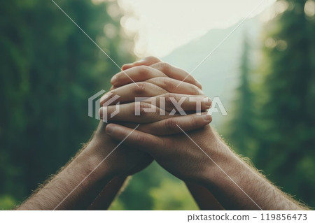 Hands Together in Support Against Natural Background Hands Together in Support Against Natural Background 119856473