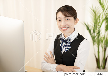 Smiling businesswoman with a computer Smiling businesswoman with a computer 119856618