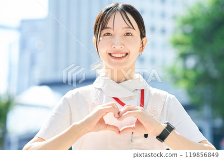 A woman in a white coat posing to give a sense of security 119856849