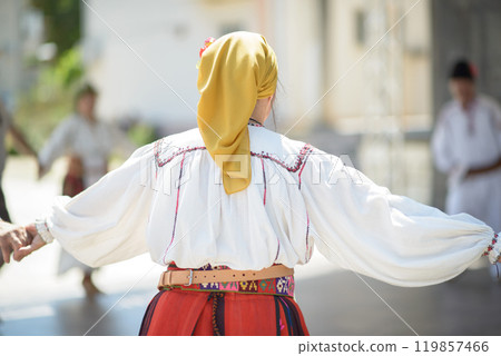 Authentic Vlach Folk Attire with Yellow Headscarf and Embroidered Blouse Authentic Vlach Folk Attire with Yellow Headscarf and Embroidered Blouse 119857466