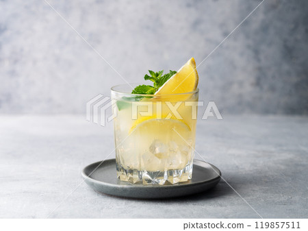 Mojito cocktail with fresh lemon, mint and ice. Refreshing citrus lemonade drink  119857511