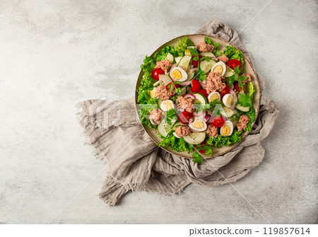 Tuna salad, vegetable salad with quail eggs, lettuce, red onion and cucumbers, on a light gray table, keto food, lifestyle, healthy eating, selective focus, top view, no people, Tuna salad, vegetable salad with quail eggs, lettuce, red onion and cucumbers, on a light gray table, keto food, lifestyle, healthy eating, selective focus, top view, no people, 119857614