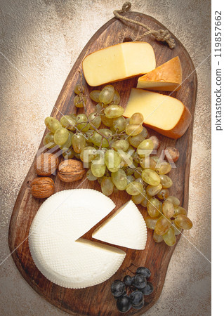 Georgian cheese, Imeretian and smoked suluguni, grapes, nuts, on a cutting board, Georgian cuisine, no people, 119857662