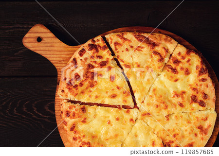 Imereti khachapuri, Traditional Georgian dish, flatbread with cheese, top view, no people, rustic, Imereti khachapuri, Traditional Georgian dish, flatbread with cheese, top view, no people, rustic, 119857685
