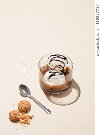 Affogato coffee with vanilla ice cream scoops with chocolate and espresso in a glass Affogato coffee with vanilla ice cream scoops with chocolate and espresso in a glass 119857756