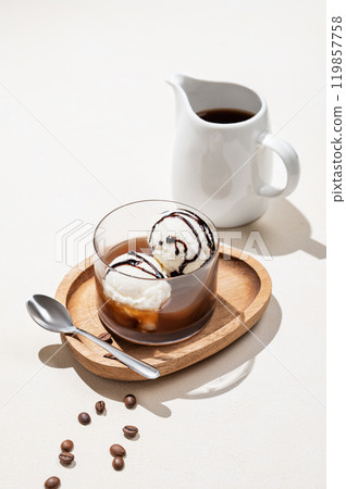 Affogato coffee with vanilla ice cream scoops with chocolate and espresso in a glass Affogato coffee with vanilla ice cream scoops with chocolate and espresso in a glass 119857758