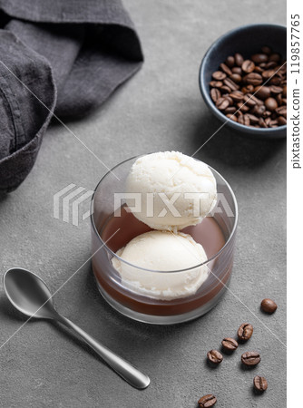 Affogato coffee with vanilla ice cream scoops and espresso in a glass on a dark background Affogato coffee with vanilla ice cream scoops and espresso in a glass on a dark background 119857765