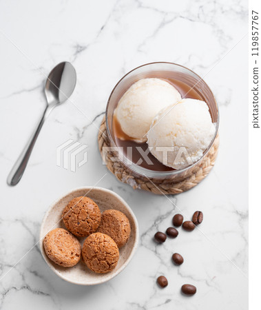 Affogato coffee with vanilla ice cream scoops and  espresso in a glass on a marble background 119857767