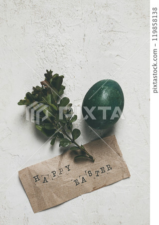 easter card, green egg, boxwood branch, typewritten text , happy easter, 119858138