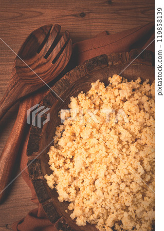 cooked couscous, in a wooden bowl, top view, no people, 119858139