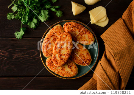 Chvishtari, corn flour tortillas with cheese, pastries, Georgian cuisine, Mchadi, homemade, top view, on a wooden table, no people, Chvishtari, corn flour tortillas with cheese, pastries, Georgian cuisine, Mchadi, homemade, top view, on a wooden table, no people, 119858231